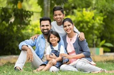 happy indian couple kids embracing 260nw 2383847981 e1726202059531.webp